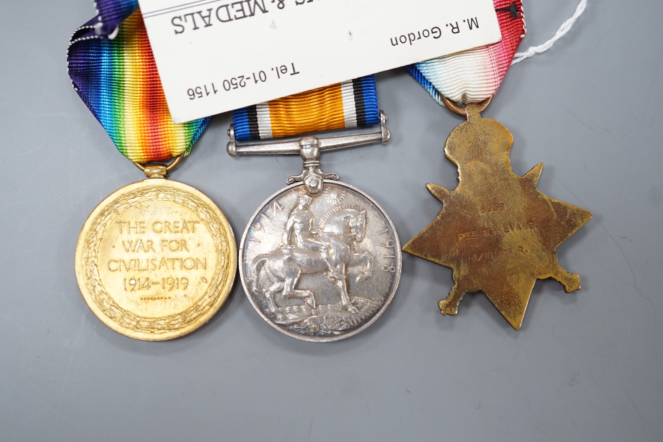 A WWI Mons star trio to 6958 PTE. W. H. EVANS WILTS R.